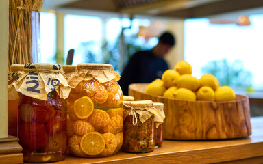 citrus fruits in a jar on a shelf