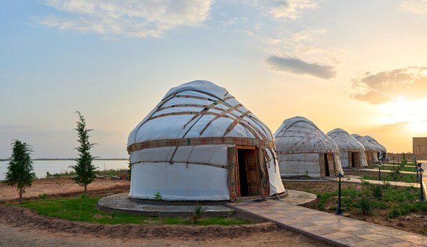 old asian yurts at sunset