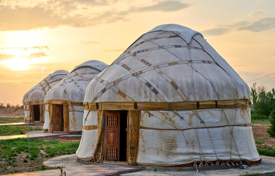 old asian yurts at sunset