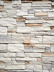 Facade decoration with decorative natural stone. Texture of decorative stone