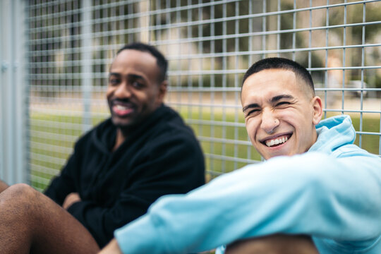 Young neighborhood men laughing