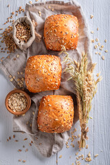 Homemade and hot oat buns made of wheat grains.