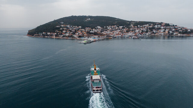 drone photo of a ferry approaching Adalara Islands in Turkey