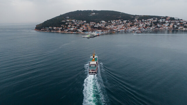 drone photo of a ferry approaching Adalara Islands in Turkey