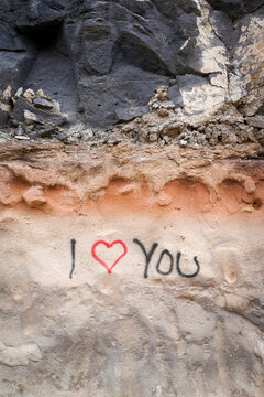 The phrase "i love you" on a wall.