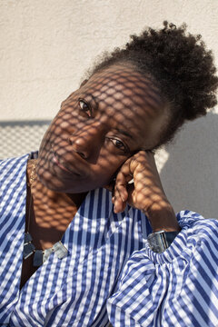 confident pensive woman creative portrait with shadow on the face