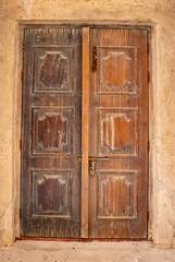 Fototapeta na wymiar UAE March 2022. Old wooden door in a building in the old town area.