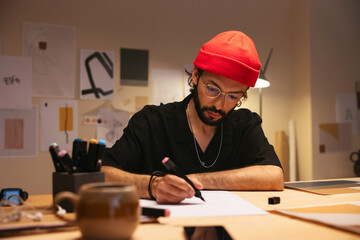 Male designer drawing marker pen