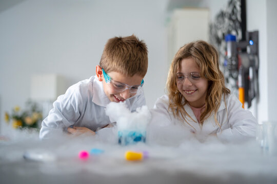 Happy children observing an experiment