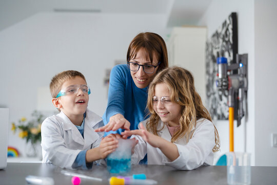 Mother and kids touching chemical smoke