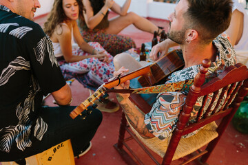 Top view of a group of friends playing music