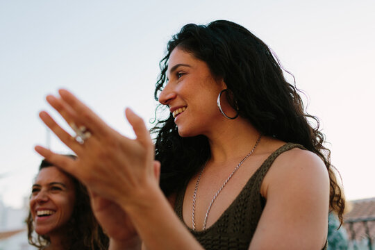 Woman clapping her hands while singing flamenco