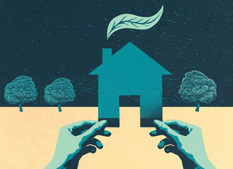 Hands hoding green house symbol 