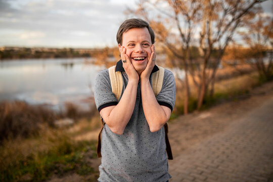 Man with down syndrome laughing happy
