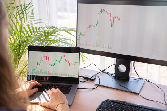 Anonymous Man Analysing Charts