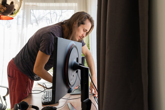 Man Connecting Computer At Home