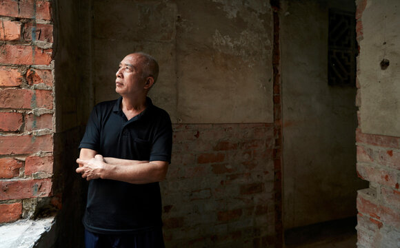 Asian middle aged man at home

