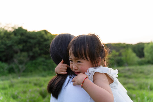 Crying Child On Mother's Shoulder