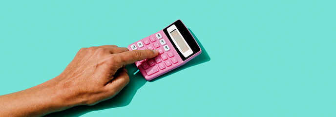 using a pink calculator in web banner format