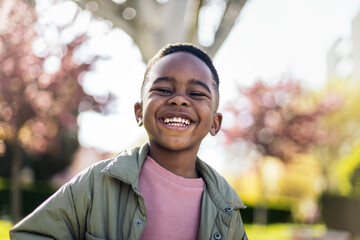 Portrait of smiling little boy outside