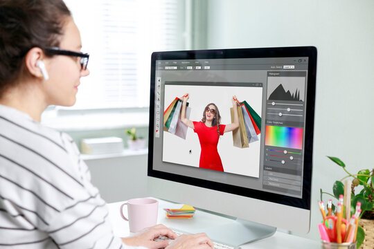 Graphic designer artist editing photo on computer.