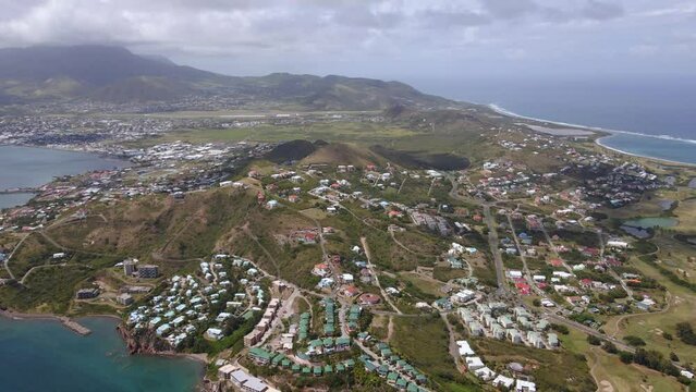 Aerial view overlooking island of St Kitts in Saint Kitts and Nevis - high angle, panoramic, drone shot