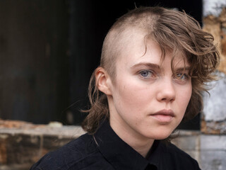 Young girl cuts her head bald