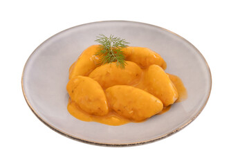 dumplings with tomato sauce in a plate on a white background