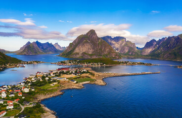 Obraz premium Reine fishing village surrounded by high mountains and fjords on Lofoten islands