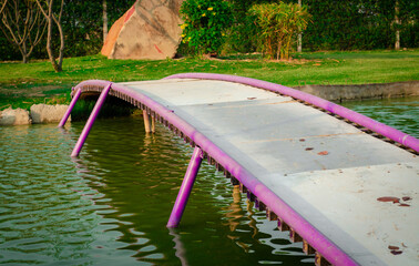 Cute little foot over bridge over artificial lake