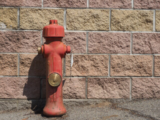 fire hydrant before a wall