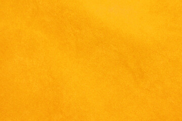 Yellow velvet fabric texture used as background. Empty yellow fabric background of soft and smooth...