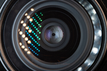 Professional camera photo lens. Details of glass, layer of enlightenment, aperture petals. Light...