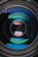 Professional camera photo lens. Details of glass, layer of enlightenment, aperture petals. Light...