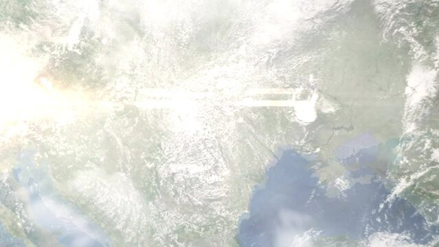 Earth zoom in from outer space to city. Zooming on Botosani, Romania. The animation continues by zoom out through clouds and atmosphere into space. Images from NASA