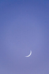 Obraz na płótnie Canvas Close-up of a small crescent moon at Pfeiffer Beach, california.