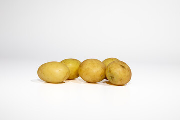 Group of fresh potatoes isolated on white background close up