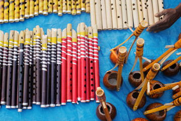 KOLKATA, WEST BENGAL , INDIA - NOVEMBER 23RD 2014 : Flutes and monchords, artworks of handicraft,...