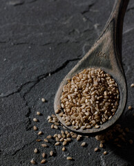 Sesame seeds in wooden spoon