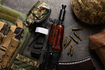 Military body armor, helmet and ammunition, a Kalashnikov assault rifle with matrons and a first...