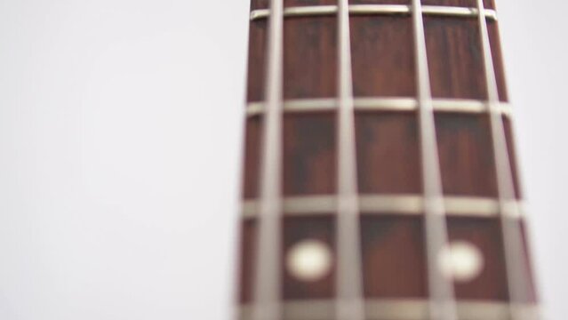 Close up of bass guitar frets 
