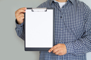 Man holding clipboard with blank paper sheet - Powered by Adobe
