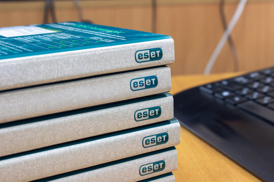 Sochi, Russia - May 10 2022: A stack of installation discs of ESET NOD32 antivirus software. Installing or updating antivirus programs in the organization. Protecting company computers from viruses