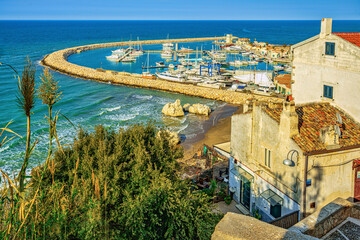 Naklejka premium Top view of the touristic port of Rodi Garganico and the beach. Rodi Garganico, Province of Foggia, Puglia, Italy, Europe
