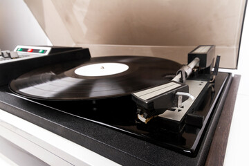 Close up of turntable needle on a vinyl