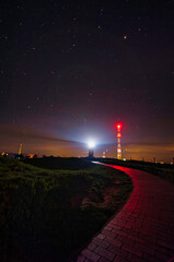 Lighthouse on the island of Helgoland at night with a path