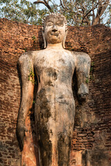 Ancient Standing Buddha Statue in historical park