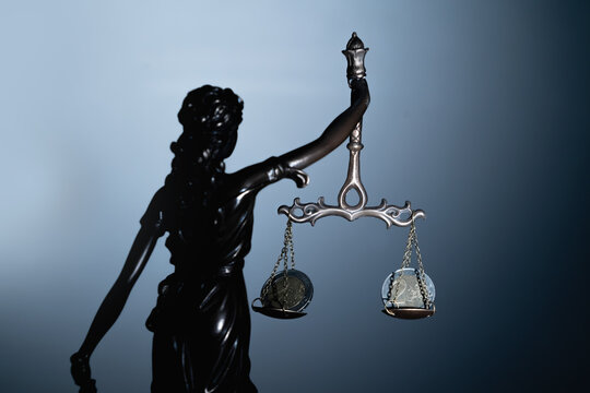 Silhouette of statue of goddess of justice Astraea with mechanical weighing scale and Euro money as symbol of bribery, injustice and double standards in Europe.