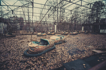 Rusty old children's machine in an abandoned amusement park in carting, the ghost town of Pripyat,...