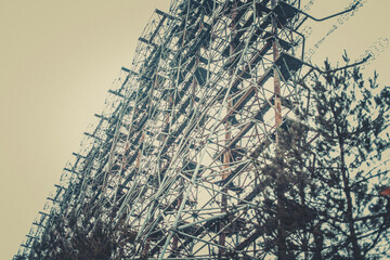 Rusty old children's machine in an abandoned amusement park in carting, the ghost town of Pripyat,...